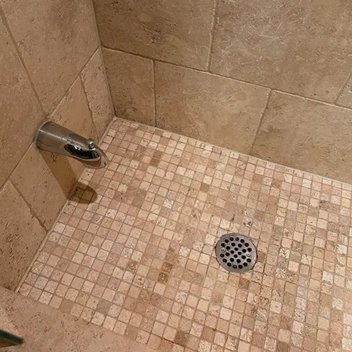 Shower floor tile and grout after restoration